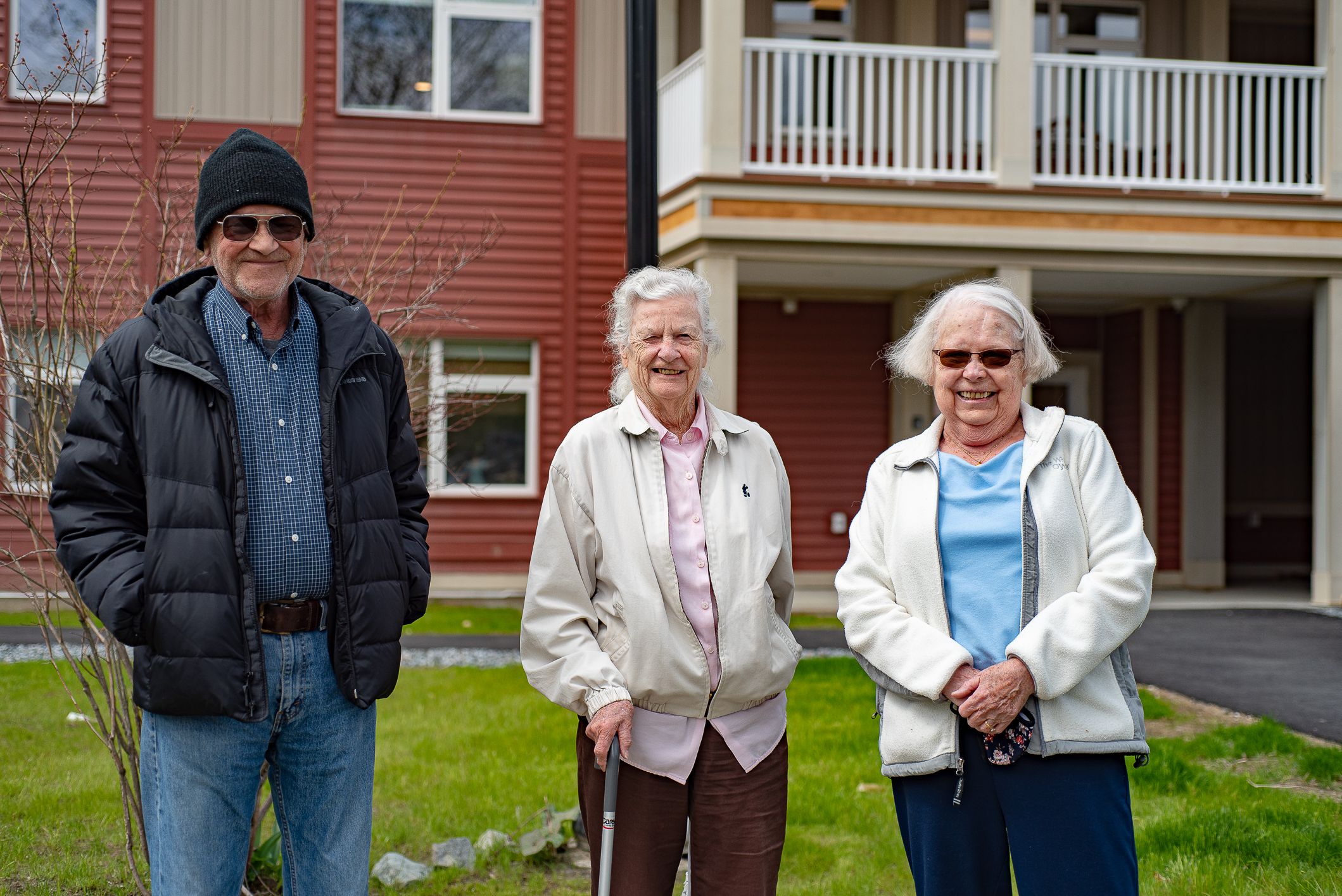 Summer park residents in front of building